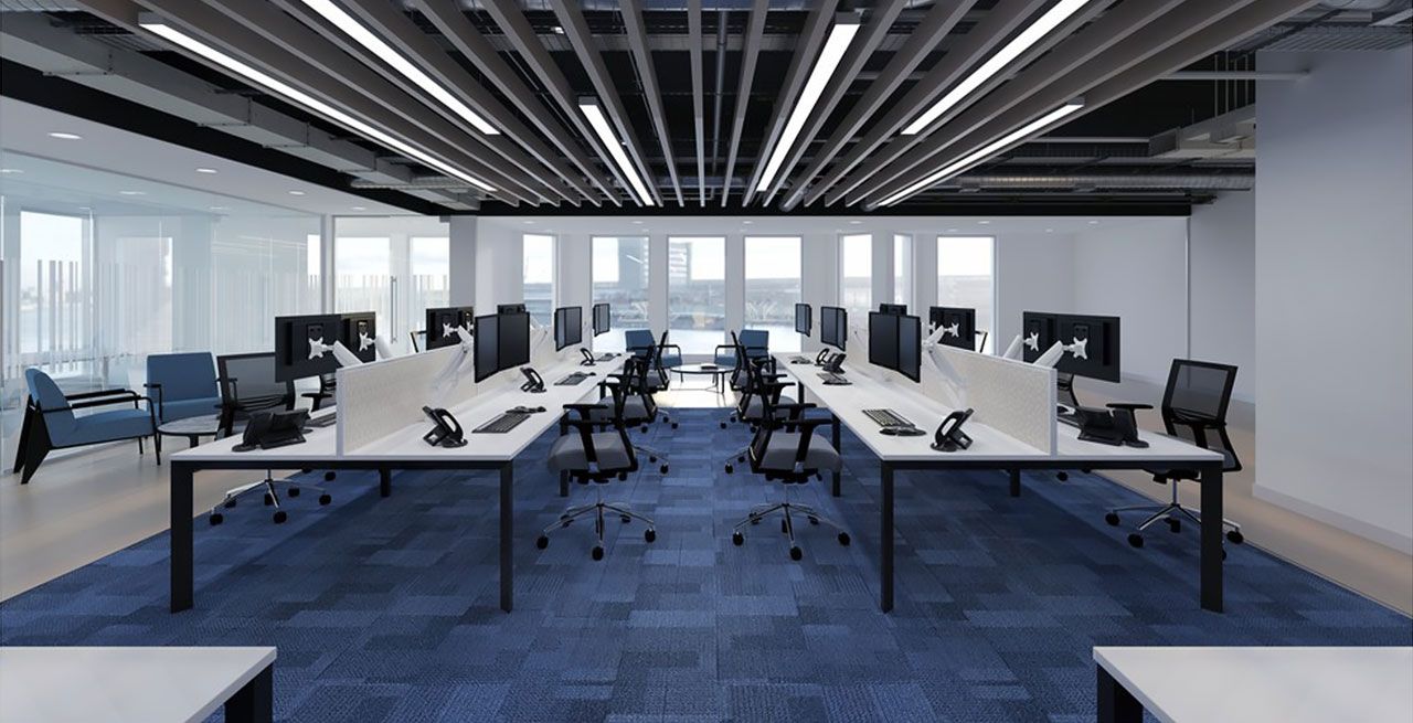 An office with multiple workstations and desks set up